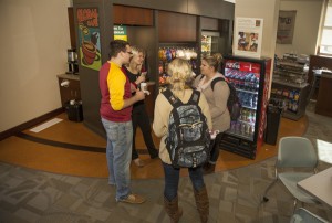 Students gather by the Global Cafe in Harl Commons to enjoy Ugandan, fair-trade coffee