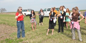 Professor Mary Wiedenhoeft gives a tour of a farm plot to participants in the World Food Prize Youth Institute