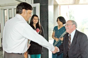 Lester Wilson shakes hands with his hosts before a Borlaug Fellowship workshop in 2009 in India.