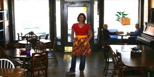 Heidi Bell poses inside her coffee shop in Leon, Iowa