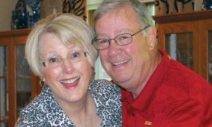 Eric and Karen Hoiberg lovingly pose for a picture in their home