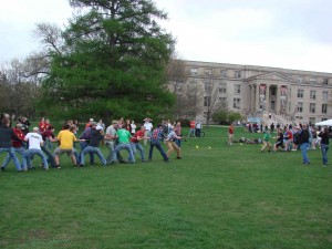 Forestry club students participate in a tug-of-war in the lush green grass on central campus outside of Curtiss Hall