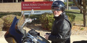 John Lawrence sits on his motorcycle in front of the Iowa State University Extension office in Grundy County.