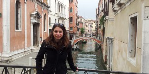 Alexandria Harvey stands on a bridge above a canal in Venice