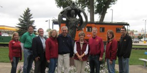 Maury and Martha Kramer along with Den Wintersteen and ISU alum and administrators are pictured in front of the Borlaug statue in Cresco.