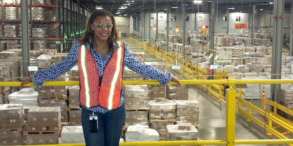 Laynnea Jones wears a protective jacket while overlooking the distribution facility at L'Oreal