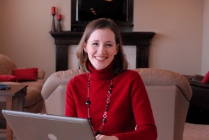 Lisa Peterson sits in her home with laptop