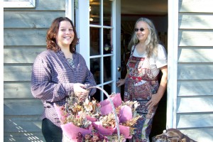Maggie Howe's mom greets her at the door as Maggie carries a large basket of dried flowers home to make natural bath and body care products.