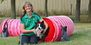 Assistant Professor Cheryl Morris practices agility with her rescue dog