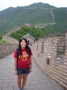Headshot of Tia Sandoval wearing an ISU shirt at the Great Wall of China