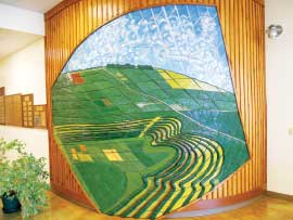 A mural of an areal view over fields at the Wallace Learning Center