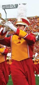 An Iowa State marching band trumpet player, perform on the field at Jack Trice Stadium