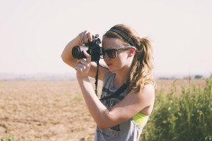 Lexi Marek takes photographs during her internship with FarmHer