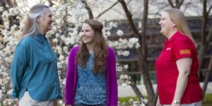 Mary Wiedenhoeft, Lizzy Widder and Stephanie Zumbach visit outside Agronomy Hall.
