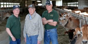 Joe Lyon with son Eric and nephew Stuart on their dairy farm