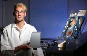 Tad Beekman, a junior in food science, studies the effects of irradiation on enzymes