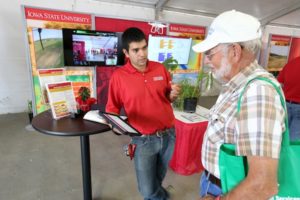 Rafael Martinez-Feria visits with farmer at 2016 Farm Progress Show