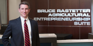 Kevin Kimle stands in front of the Agricultural Entrepreneurship Suite which he is a director of