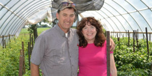 Greg and Polly Rinehart pictured in their greenhouse