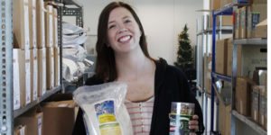 Ellen Walsh-Rosmann holds packaged foods used in her business