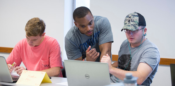 Brandon Washington helps students plot out their degree audits in Bessey Hall.