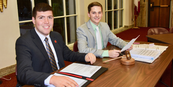 Vice President and President of CALS Council sit at desk with gavel and notes