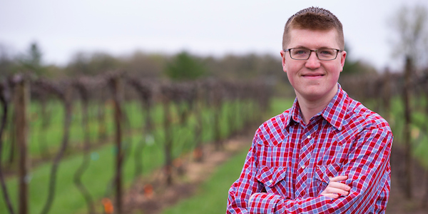Agronomy student Jacob Wright at the vineyard at the Horticulture Research Station